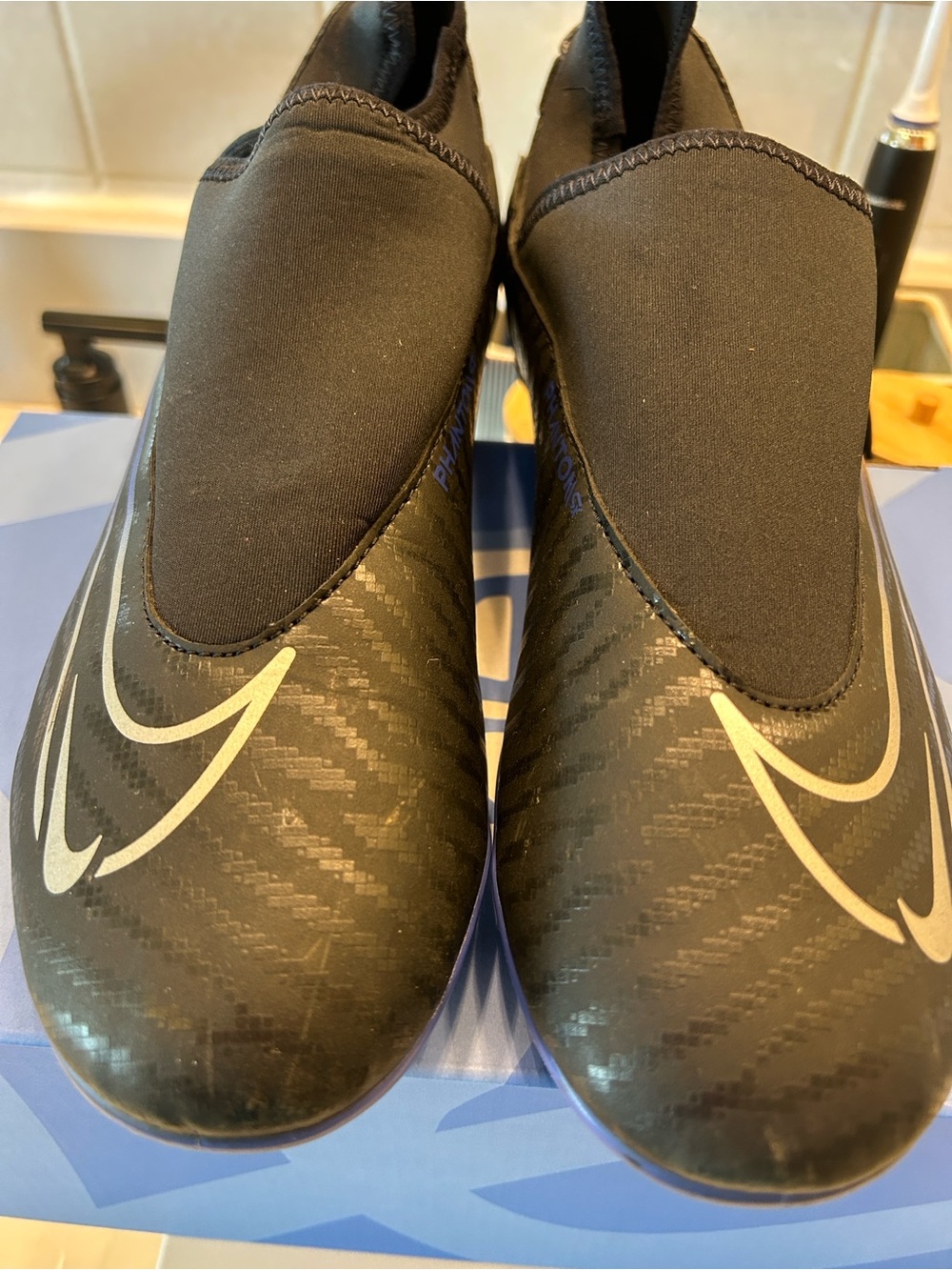 Nike Phantom Black and white soccer cleats with White Swoosh